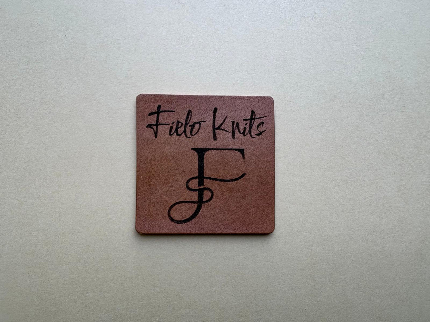 Groot leren label vierkant fielo knits ontwerp